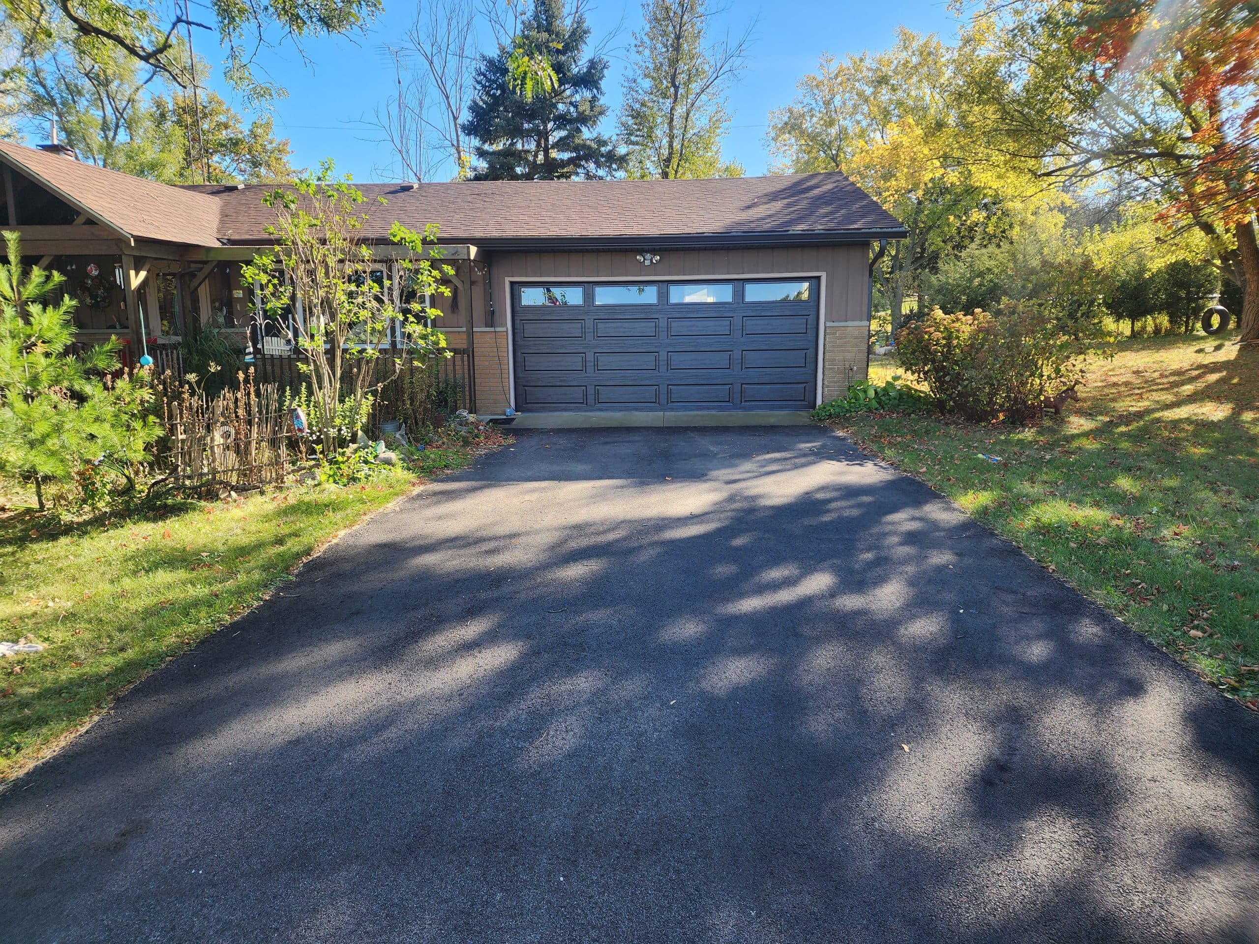 Carriage-style garage door installed on a Wisconsin ranch home