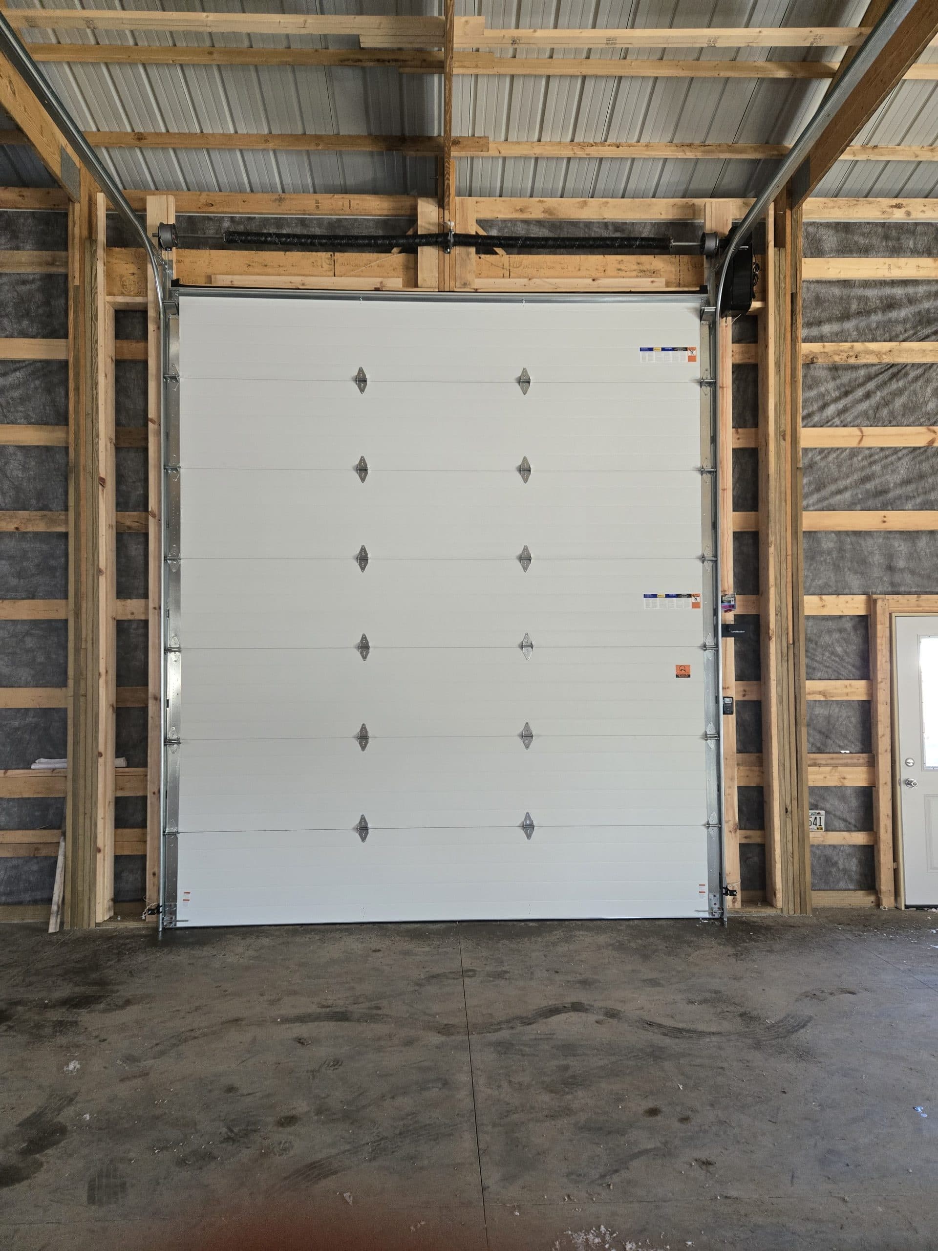 Garage door repair in a pole barn